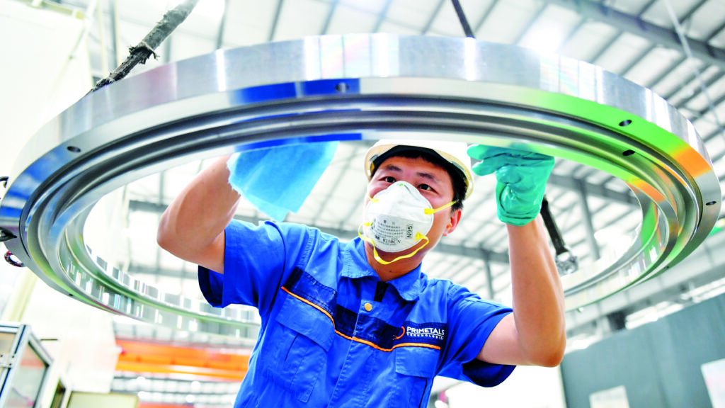 A view of an employee of Primetals Technologies from a services workshop in China