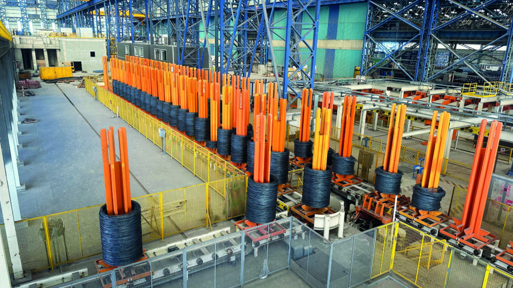The coil-handling area of the upgraded wire-rod mill demonstrates the size of the modernization project as well as Kaptan's commitment to operational excellence. Extensive Level 1 and Level 2 automation throughout the mill lets workers use a tablet-style mobile control panel to control the production equipment.